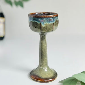 Wheelthrown goblet designed as a Miriam's Cup for the Passover seder table. Use it for Elijah, as a weekly Shabbat kiddish cup, a unique wine glass, or any spiritual practice. A  complex layered frosted iron lustre glaze reveals areas of purples, pinks, yellows and icy blues where the glazes meet and marry. Glaze On Studio | small batch functional pottery for home and table.